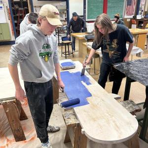 Nathan Percival and Preston Giles (right) apply a fresh coat of paint. Courtesy of Chris Liberti.
