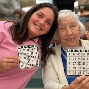 Interact member and BRHS German exchange student Frida Kirchhauser with resident Joann Amos. Courtesy of Bob Drury
