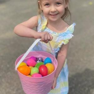 Reese Washburn with her full basket of eggs at the 2025 Easter Eggstravaganza. Courtesy photo