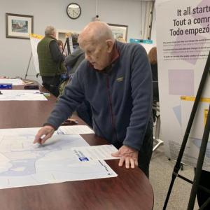 A resident points out areas affected by climate change. ISABELLE CURTIS/Boothbay Register