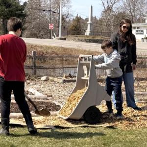 Students at Southport Central School lay cardboard and wood chips to create paths in preparation for another planting season at the community garden. Courtesy of Shawn Gallagher 