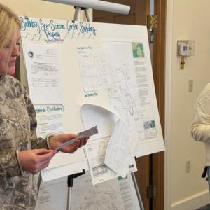 A high school class project resulted in providing the Boothbay Sea and Science Center with advice on combatting the impact of rising sea levels on its boat house and two educational buildings. Four groups of students provided their research and recommendations April 10 to Boothbay Planning Board Chairman Bruce Bowler and Code Enforcement Officer Dan Feeney at the municipal building. Pictured are Piper McKane, left, and Aileigh Johnson. BILL PEARSON/Boothbay Register