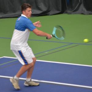 Ronan Drage tracks down the ball during his second doubles match against Madison. KEVIN BURNHAM/Boothbay Register