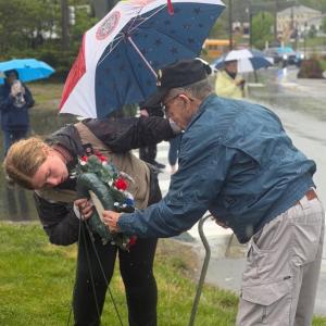 Addie Barter and Arthur Richardson place a wreath at the Boothbay ceremony. BILL PEARSON/Boothbay Register