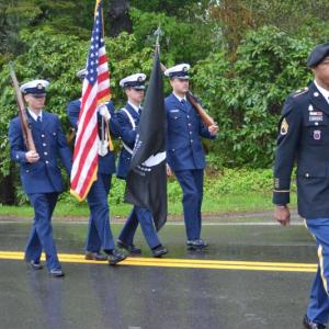 Memorial Day master of ceremonies Chris Armstead and the Coast Guard color guard at Newagen. KEVIN BURNHAM/Boothbay Register