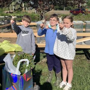 CMBG's Beth Jarvis gifts the Questers snail finger puppets for their hard work. ISABELLE CURTIS/Boothbay Register