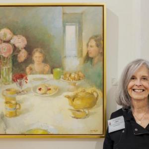 Tina Ingraham with her painting “High Tea” at Maine Art Gallery, Wiscasset, ME. Bob Bond photo