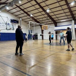 A player serves the ball to the opposing team. Photo by Trevor Tibbetts 