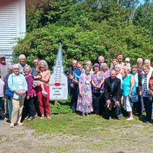 Members and Friends of the Edgecomb Community Church stand by the new capital campaign sign which will record the progress of their fundraising efforts. Courtesy photo