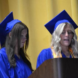 Aileigh Johnson, left, and Piper McKane present the class prophecies. KEVIN BURNHAM/Boothbay Register
