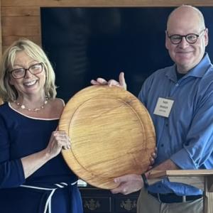 Holly Stover accepting a commemorative plaque from Keith Metrich, Chair, LCDC at awards ceremony. Courtesy photo