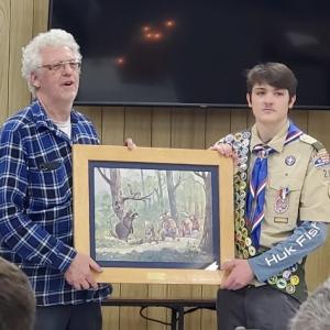 Former Scoutmaster Chris Roberts presents a Maurice Day print to Jeffrey McKinney, Eagle Scout, at the June 18 ceremony. Courtesy photo