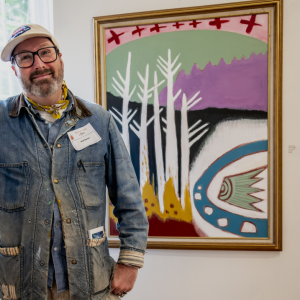 Matt Barter with his painting "March Bog #3" at the current Maine Art Gallery show. Photo by Bob Bond