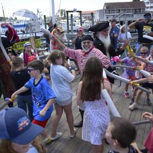 A violent clash occurred on the town pier as pirates and kids fought for control of the harbor. ISABELLE CURTIS/Boothbay Register
