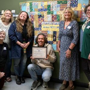 Andrew Slater, MMCA Child and Family Services Director, with MMCA staff and board members. Courtesy photo
