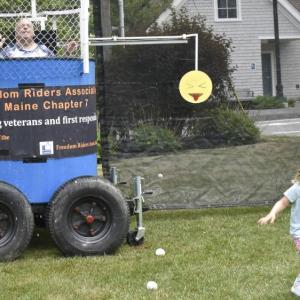This gleeful wee girl runs back to her family after sinking Marine Corps veteran Charlie Stanley at the BCA's Fourth on the Common July 3. LISA KRISTOFF/Boothbay Register