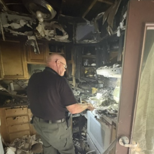State Fire Marshal Ken MacMaster investigates the cause of a fire at the Campbell Apartments. Mark Sullivan photo