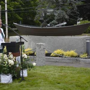 White and Green Hope Founder Liz Michaud opens ceremonies July 21st in Boothbay Harbor for Maine's first state Commercial Fishing Remembrance Day.  ISABELLE CURTIS/Boothbay Register