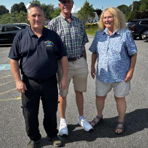 BRAS Board President Robbie Ham greets original ambulance service volunteers Jon and Cindy Smith at the open house. KEVIN BURNHAM/Boothbay Register