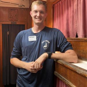 Considering his time aboard Corwith Cramer a formative undergraduate experience, Nathan Miller now helps shape memories as a deckhand.   ISABELLE CURTIS/Boothbay Register