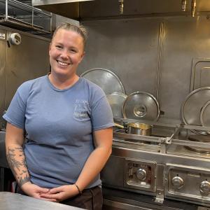 Shelby Mann, who participated in one of SEA's college programs, now helps students in the kitchen.  ISABELLE CURTIS/Boothbay Register