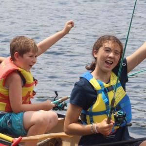 The Y’s mission in action: boating and fishing at Camp Knickerbocker this summer, just one of so many opportunities for children at the Y. Courtesy of Camp Knickerbocker summer camp staff