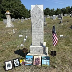 The celebration of George Parker Matthews at Ocean View Cemetery in Boothbay included the placement of photos, an American Flag and a U.S. Light House Service marker. Courtesy photo
