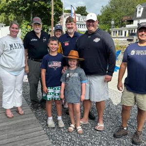 Winners of raffle and members of the VFW. Pictured from left, Megan Gill, Ed Harmon, Kiki, Brad Drummond, Brendan Gill, Justin Morgan; children, Emily and Liam. Courtesy of Jen Mitchell