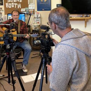 BRTV cameraman Robert Jordon sets up the shot for Chip Schwehm's performance on the station's newest show, "The Sound Booth."  ISABELLE CURTIS/Boothbay Register