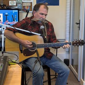 In addition to his guitar and footboard, Schwehm also incorporates harmonica into his performances. ISABELLE CURTIS/Boothbay Register