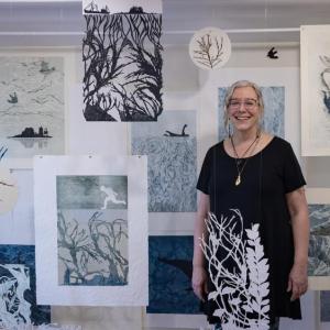 Suzanne Stokes with her installation of monoprints. Courtesy of SML
