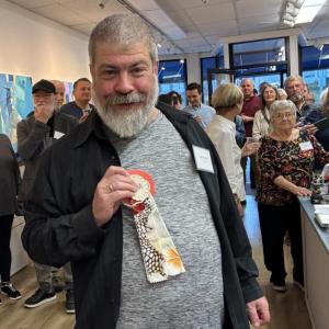 Charlie Nowell shows off his Honorable Mention ribbon for "Birds of Paradise." LISA KRISTOFF/Boothbay Register