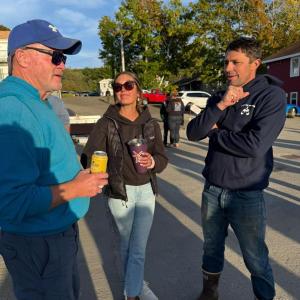 Business owners Dave Bean, left, talks with Kristin and Nick Page at the party. Courtesy photo