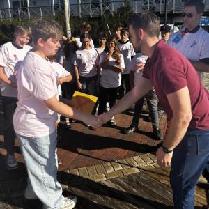 Eighth grader Sawyer Piercy presents the donation to Ray Ruby. KEVIN BURNHAM/Boothbay Register