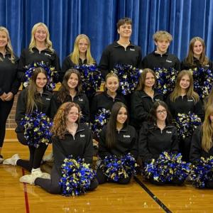 The 2026 Boothbay Region High School cheerleading team. Pictured from left are, front row: Bea Wormwood, Briella Green, Kaye Hallinan, Maya Jacobs; middle row: Ashlynn Andrews, Cali McDuff, Emma Doucette, Izzy Andreasen, Jessie Ullo, Hallie Arbogast; back row:  Coach Michele Ripley, Assistant Christian Jewett, Brianna Campbell, Olivia Rittal, Ronan Drage, Titan Lewis, Annie Whitney and Assistant Mady McLellan. ISABELLE CURTIS/Boothbay Register