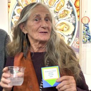 Artist Georjean Machulis, the People's Choice for her mixed media, "Divine Mother." LISA KRISTOFF/Boothbay Register