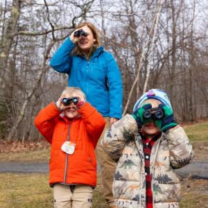 Boothbay Region Elementary School students practice bird watching with Tracey Hall, environmental educator from the Boothbay Region Land Trust. Photo by Brass Duck Photography/Used with permission