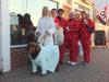 Cathi Bertin (far left) with her dog Tucker and red pajama-clad friends outside Red Cup.  KEVIN BURNHAM/Boothbay Register