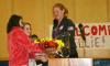 Ellie Logan receives flowers from two BRES students before she talked about her Olympic experiences. KEVIN BURNHAM/Boothbay Register