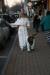 Cathi Bertin and her dog Tucker take to the streets in search of Early Bird deals. KEVIN BURNHAM/Boothbay Register 