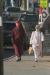 Kit and Leigh Sherrill walk along Commercial Street as they head for another store during the Early Bird Sale Saturday morning. KEVIN BURNHAM/Boothbay Register