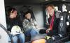 Riding in the cab of Boothbay Harbor's ladder truck with Ellie Logan are Ellie's good friend, Miranda Sherman, and her cousing, Thomas Wilcox. SUE MELLO/Boothbay Register