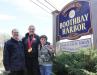 Boothbay Harbor Town Manager Tom Woodin with Ellie Logan and her cousin, Thomas Wilcox, during the sign presentation. SUE MELLO/Boothbay Register