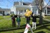 House of Logan employees wave to Ellie Logan as the two-time Gold Medal winning athlete is paraded through downtown Boothbay Harbor. SUE MELLO/Boothbay Register