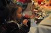 Scarlet Pope applies the final touches to her gingerbread house. BEN BULKELEY/Boothbay Register