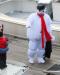 Frosty the snowman (Todd Savage) waves to a young fan after arriving with Santa for the Harbor Lights Festival. GARY DOW/Boothbay Register