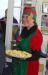 An adult elf (Mary Yokabaskas) offers cookies to those at Lap Time with Santa and Mrs. Claus at the Memorial Library. GARY DOW/Boothbay Register