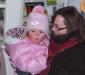 Hannah Abby's cheeks are rosy red as her grandmother, Sarah, holds her while waiting to see Santa. GARY DOW/Boothbay Register