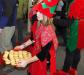 Called into duty to hand out cookies at Lap Time with Santa is this elf (Liza Cheney). GARY DOW/Boothbay Register