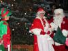 Santa and Mrs. Claus and an elf join in the caroling. SUE MELLO/Boothbay Register
